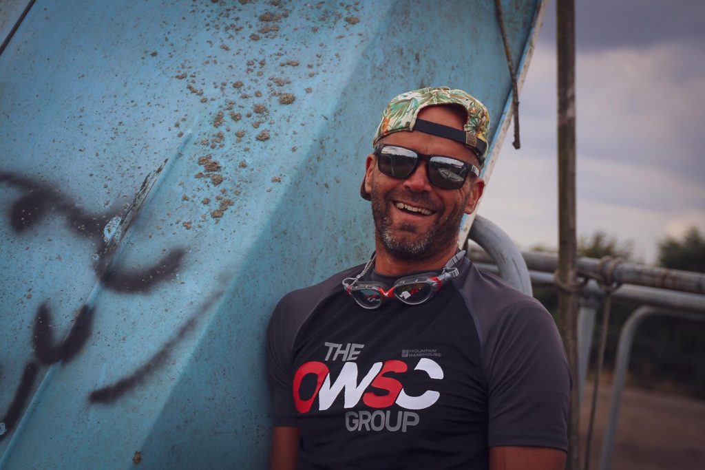 Mat Hawkes smiling and wearing TOWSC rash vest